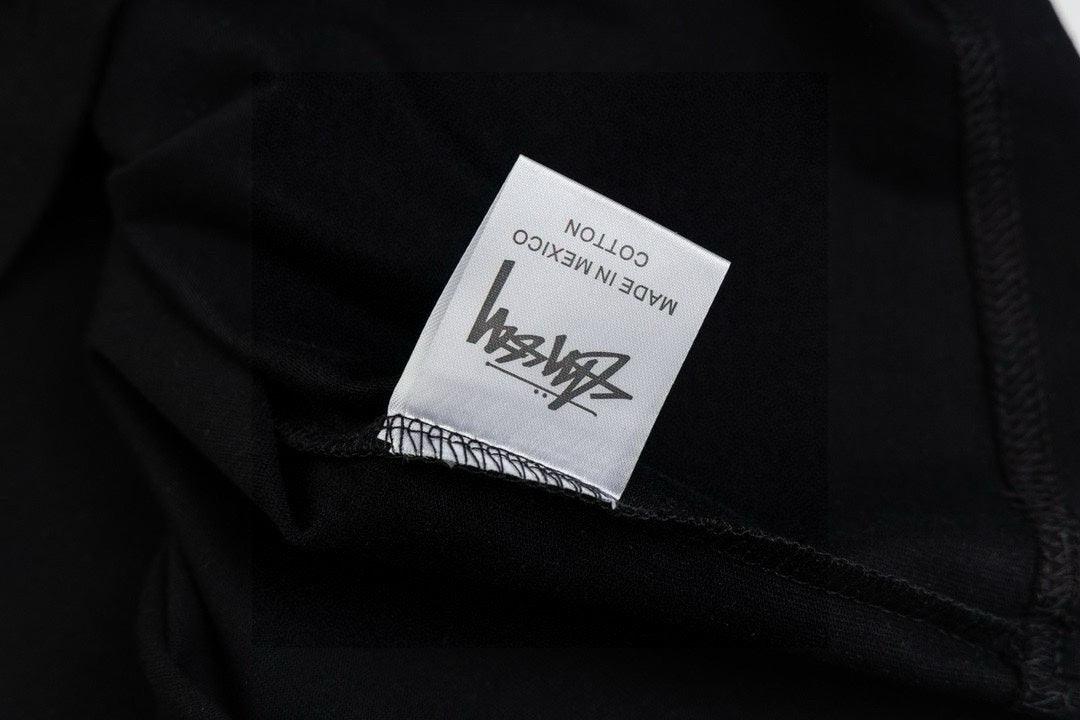 Stussy Black Short Sleeve T-Shirt with Fish Graphic Logo