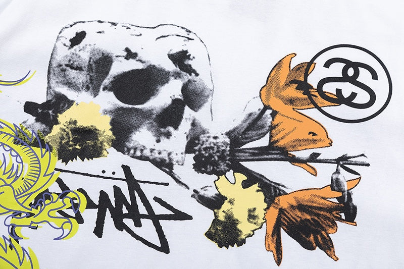 White Stussy Graphic T-Shirt with Skull, Dragon, and Floral Print