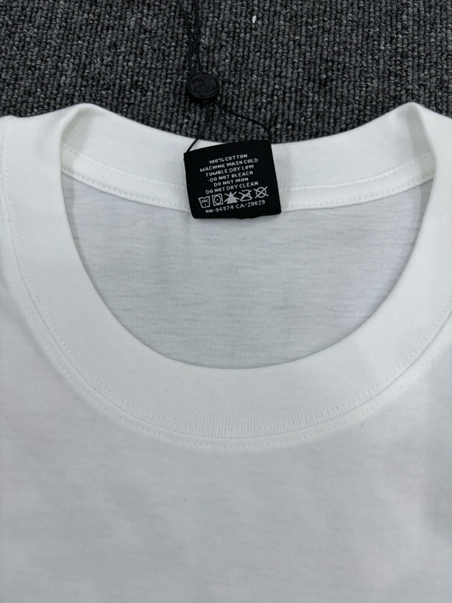 Stüssy White T-Shirt with Gold Chest Logo & Back Graphic