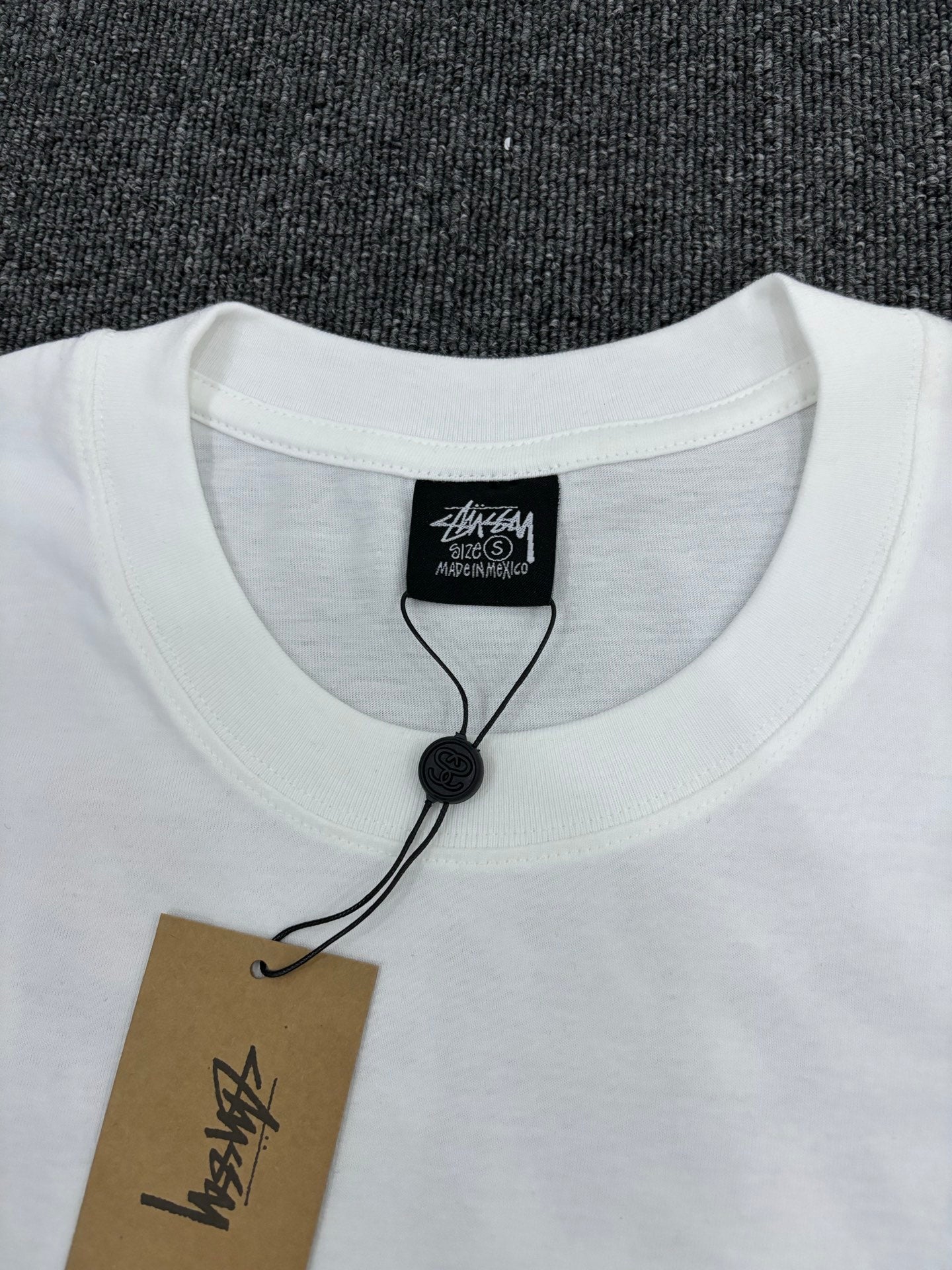 Stüssy White T-Shirt with Gold Chest Logo & Back Graphic
