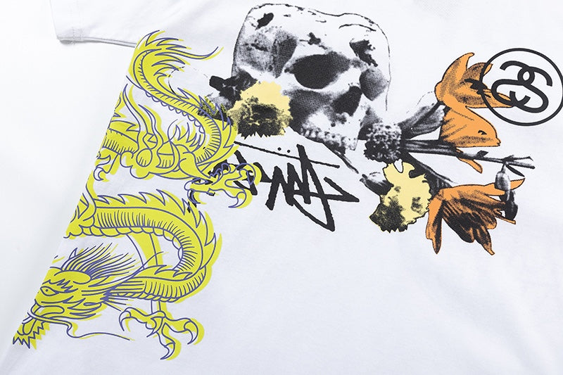 White Stussy Graphic T-Shirt with Skull, Dragon, and Floral Print